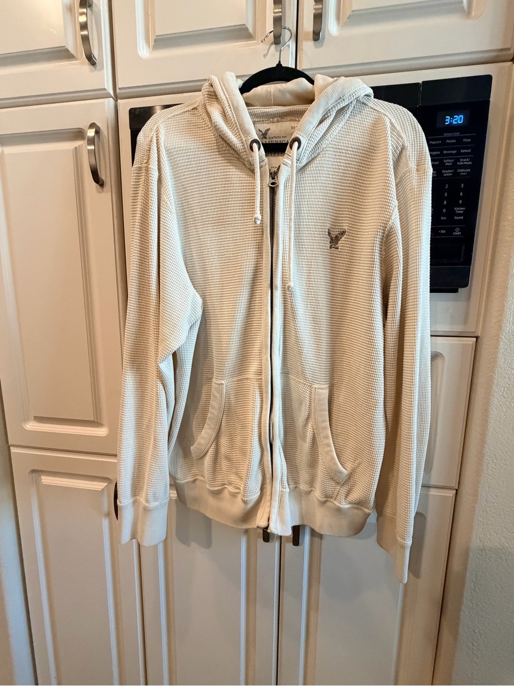 American Eagle Outfitters Cream Waffle-Knit Hoodie Label Detail